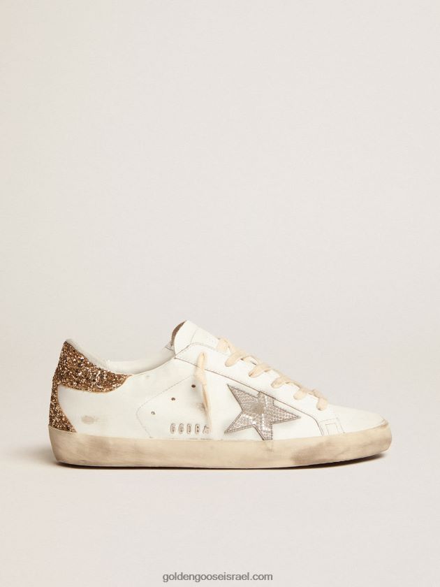 נשים Golden Goose נעלי ספורט סופר-סטאר עם כוכב עור כסף בהדפס נחש ולשונית עקב נצנצים מזהב 246D246